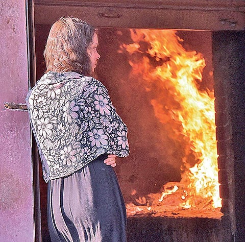 Latvian Ilze Skromane looks at the body of her sister getting cremated in Thiruvananthapuram on Thursday | B P Deepu