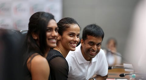 Pullela Gopichand with Saina Nehwal and PV Sindhu during an interactive session organised by FICCI Ladies organisation FLO in New Delhi (EPS | Shekhar Yadav)