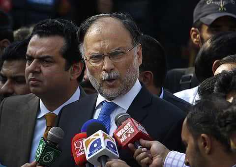 In this Oct. 2, 2017 file photo, Pakistani Interior Minister Ahsan Iqbal talks to journalists outside the accountability court, in Islamabad, Pakistan. | Associated Press
