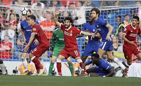 Liverpool's Mohamed Salah, center, gestures during the English Premier League soccer match between Chelsea and Liverpool at Stamford Bridge stadium | AP
