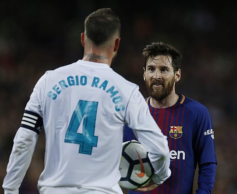 Lionel Messi was seen sliding wildly into Sergio Ramos to be booked immediately. (Photo | AP)