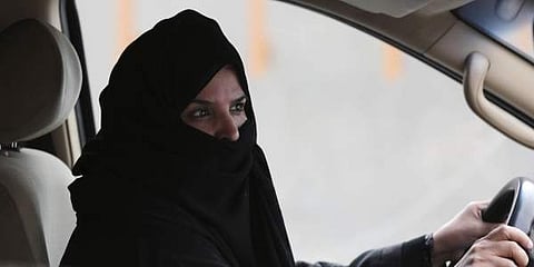 FILE- In this Saturday March 29, 2014 file photo, a woman drives a car on a highway in Riyadh, Saudi Arabia, as part of a campaign to defy Saudi Arabia's ban on women driving. (Photo | AP)
