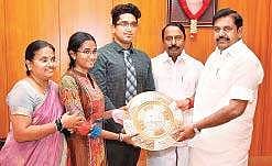 Chief Minister Edappadi K Palaniswami and Education Minister K A Sengottaiyan felicitating K A Villet Oviya on Monday,