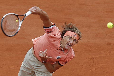 Germany's Alexander Zverev serves against Bosnia and Herzegovina's Damir Dzumhur during their third round match of the French Open tennis tournament at the Roland Garros stadium in Paris. (AP)