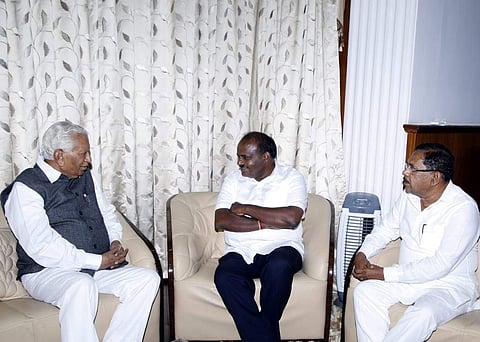 Chief Minister H D Kumaraswamy and  Deputy  Chief Minister Parameshwara met Governor Vajubhai Vala at Rajbhavan in  Bengaluru on Friday. (EPS)