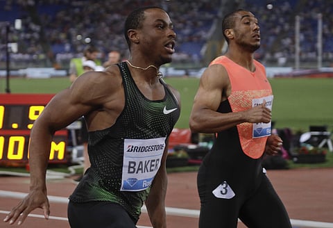 Ronnie Baker, of the United States, left, wins the men's 100m event at the Golden Gala, the first European meeting of the Diamond League, at the Rome Olympic Stadium. | AP