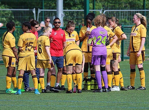 Sutton United Ladies FC head coach Justin Jose giving instructions to his players during the Greater London Women's Football League Division 2 South. (EPS)