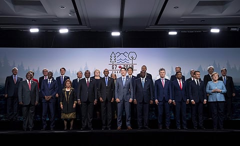 Canada's Prime Minister Justin Trudeau poses for a family photo with representatives from G7 leaders, outreach countries and international organizations at the G7 leaders summit in La Malbaie, Quebec, Canada on Saturday, June 9, 2018.(AP)