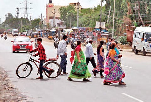 Residents crossing the National Highway 65 in RC Puram | Manikanta