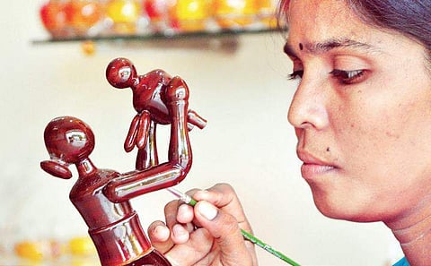 Artisans preparing Etikoppaka products at Etikoppaka village in Visakhapatnam district on Friday | G satyanarayana