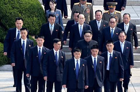 In this April 27, 2018, file photo, North Korean leader Kim Jong Un, center, is surrounded by his security guards upon his arrival for a meeting with South Korean President Moon Jae-in at the North Korean side of Panmunjom in the Demilitarized Zone. | AP