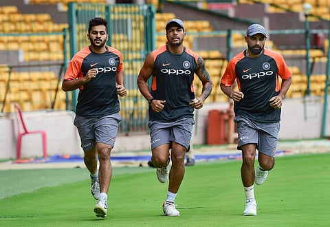Indian cricketers Md Shami, Umesh Yadav and Shardul Thakur during a practice session ahead of their maiden Test match against Afghanistan in Bengaluru on Monday June 11 2018. | PTI