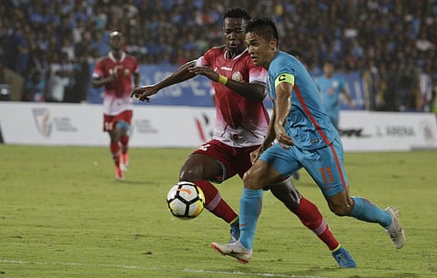Indian striker Sunil Chhetri, right, vies for the ball with Micheal Kibwage of Kenya during the Hero Intercontinental Cup final match in Mumbai. | AP