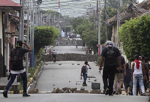 Barricades raised by members of the opposition to the government of President Daniel Ortega block roads during clashes in Masaya, Nicaragua, Saturday, June 9, 2018. (AP Photo/Oscar Duarte)