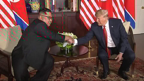 In this image made from video provided by Host Broadcaster Mediacorp Pte Ltd,, U.S. President Donald Trump and North Korean leader Kim Jong Un shake hands ahead of their meeting at Capella Hotel in Singapore, Tuesday, June 12, 2018. (Photo: AP)