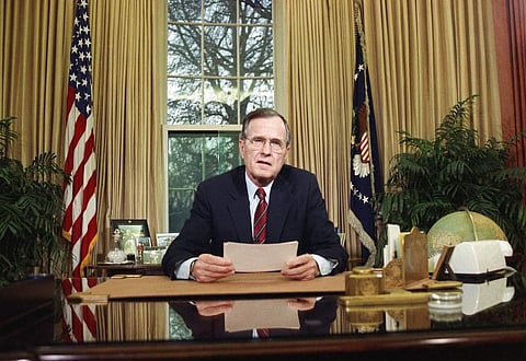 In this Dec. 20, 1989, file photo, President George H.W. Bush addresses the nation on television from the Oval Office in Washington as he explains his decision to deploy American troops to Panama. Bush is celebrating his 94th birthday in Maine. | AP