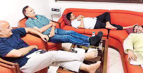 Delhi Chief Minister Arvind Kejriwal, his deputy Manish Sisodia and ministers Satyendar Jain and Gopal Rai relaxing on couches in the L-G’s office | Twitter