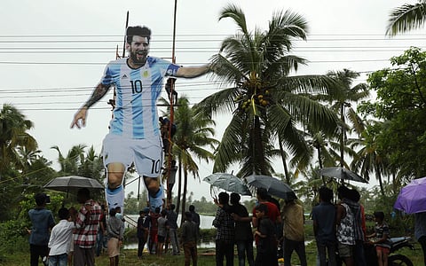 Messi fans placing a huge cutout of Argentinean striker at Chellanam in Kochi on Monday. | EPS