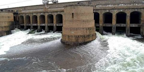 Water flowing from a dam across the Cauvery river. (File | EPS)