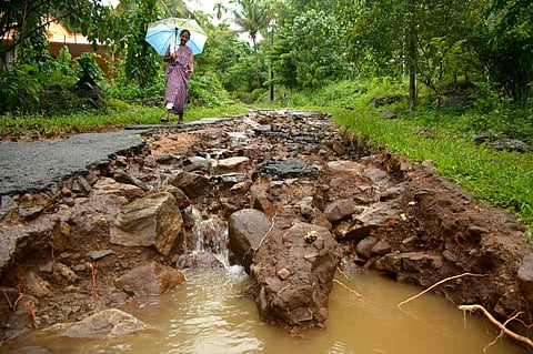 Roads connecting Karimbu and Anakkampoyil in Kozhikode seen eroded away due to gushing water during the heavy monsoon rain . (EPS |  Manu R Mavelil)