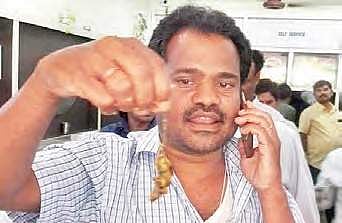 Ramesh holding the rat he found in the curry served at a hotel in Warangal on Tuesday | EXPRESS