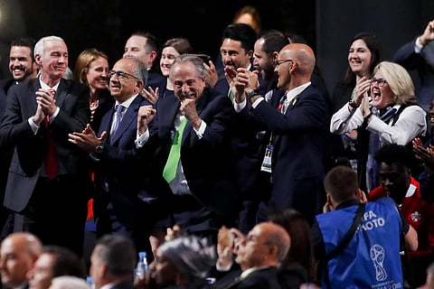 Delegates of Canada, Mexico and the United States celebrate after winning a joint bid to host the 2026 World Cup at the FIFA congress in Moscow | AP