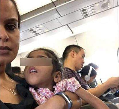 The crew of the aircraft insisted that the child sit in her seat or the family must deplane. Photo: DivyaGeorge/Facebook