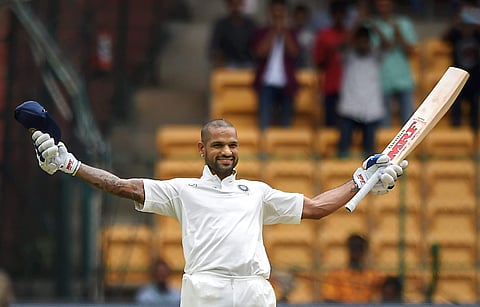 India's Shikhar Dhawan celebrates his century on the first day of the one-off cricket test match against Afghanistan at Chinnaswamy Stadium in Bengaluru. | PTI