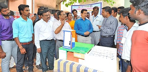 District collector Raman interacting with DRDO scientist DR Dillibabu and the TPGIT students at the school. (EPS)