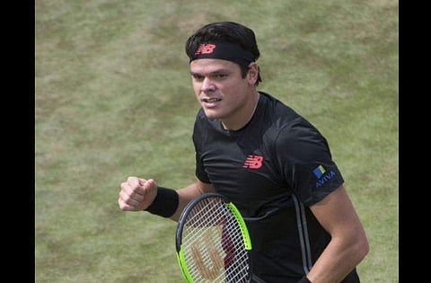 Milos Raonic celebrates after he beats Lucas Pouille in their semifinal tennis match during the ATP Mercedes Cup in Stuttgart. | AP