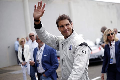 Rafael Nadal waves to supporters prior to the start of the 86th 24-hour Le Mans endurance race. | AP