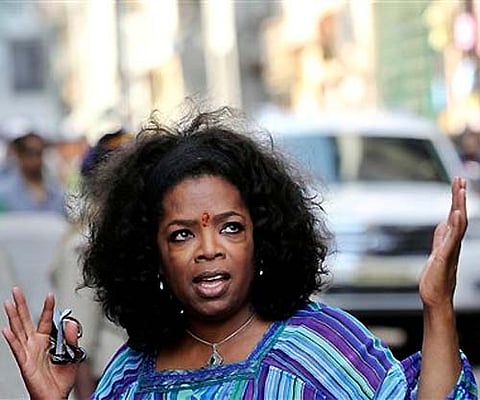 Another shot of Oprah Winfrey gesturing towards the media in Mumbai. (AP)