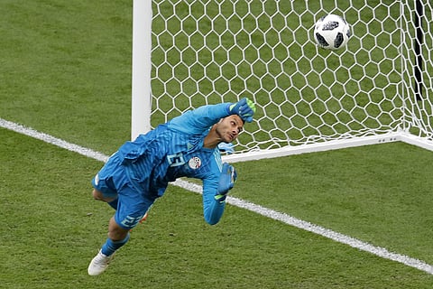 gypt goalkeeper Mohamed Elshenawy clears the ball during the group A match between Egypt and Uruguay at the 2018 soccer World Cup in the Yekaterinburg Arena in Yekaterinburg, Russia, Friday, June 15, 2018. | AP