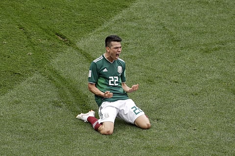 Mexico's Hirving Lozano celebrates after scoring the opening goal during the group F match between Germany and Mexico at the 2018 soccer World Cup in the Luzhniki Stadium in Moscow, Russia, Sunday, June 17, 2018. | AP