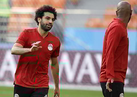 Egypt's Mohamed Salah, left, and teammate Shikabala talks during Egypt's official training on the eve of the group A match between Egypt and Uruguay at the 2018 soccer World Cup in the Yekaterinburg Arena, Yekaterinburg, Russia, Thursday, June 14, 2018. |