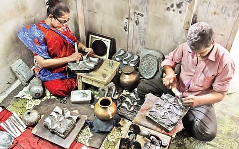 Khaleel Ahmed, a bidri worker, along with his cousin engraving designs on a  zinc-copper alloy in Pathargatti | sathya keerthi