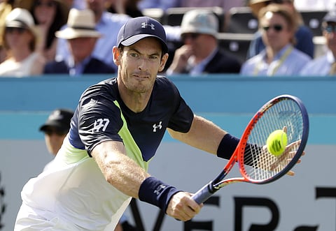 Andy Murray of Britain plays a return to Nick Kyrgios of Australia during their singles tennis match at the Queen's Club tennis tournament in London. (AP)