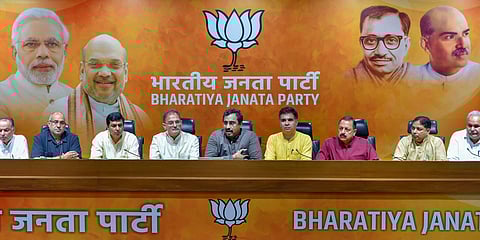 BJP in-charge for Jammu and Kashmir Ram Madhav with the state Dy Chief Minister Kavinder Gupta L and party state chief Ravinder Raina with other BJP ministers at a press conference in New Delhi on Tuesday June 19 2018. | PTI