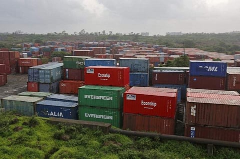 Cargo containers are seen stacked outside the container terminal of Jawaharlal Nehru Port Trust (JNPT) in Mumbai. (Photo | Reuters)