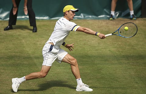 Australia's Matthew Ebden returns a ball to Germany's Philipp Kohlschreiber in their tennis ATP tournament match in Halle. (AP)
