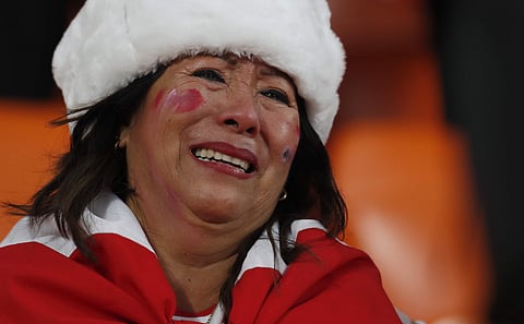 A Peruvian supporter cries at the end of the group C match between France and Peru at the 2018 soccer World Cup in the Yekaterinburg Arena in Yekaterinburg, Russia, Thursday, June 21, 2018. (AP Photo)