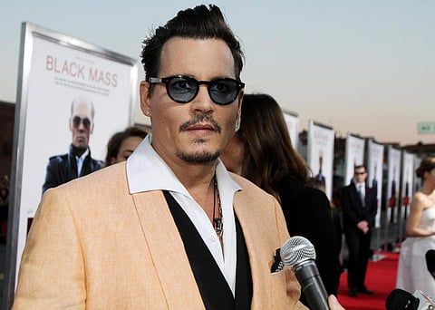 Depp sued his former business managers, Joel and Robert Mandel of The Management Group (TMG), claiming they mishandled his money and cost him millions. (Johnny Depp | AP)