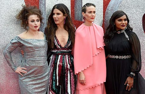 English actress Helena Bonham Carter (L), US actor Sandra Bullock (2L), US actor Sarah Paulson (2R) and US actor Mindy Kaling pose on the carpet upon arrival to attend he European premiere of the film ' Ocean's 8' in London on June 13, 2018.  | AFP