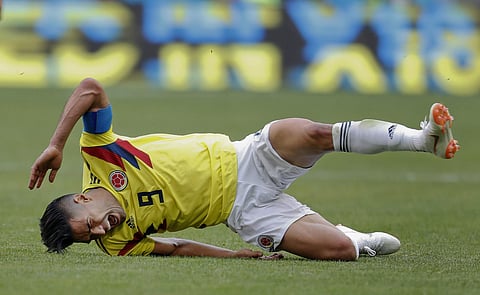 Colombia's Radamel Falcao reacts as he goes down after a challenge during the group H match between Colombia and Japan at the 2018 soccer World Cup in the Mordavia Arena in Saransk. | AP