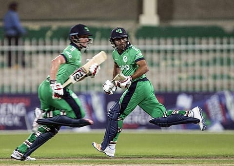 Ireland's William Porterfield (L) and Simi Singh run between the wickets during the first One Day International (ODI) cricket match between Afghanistan and Ireland at the Sharjah Cricket Association Stadium in Sharjah on December 5, 2017. | AFP