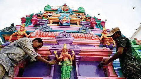 Painting works on a full swing for the upcoming Bonalu festival at Ujjaini Mahakanli temple, Secundarabad, in Hyderabad on saturday. | R Satish Babu
