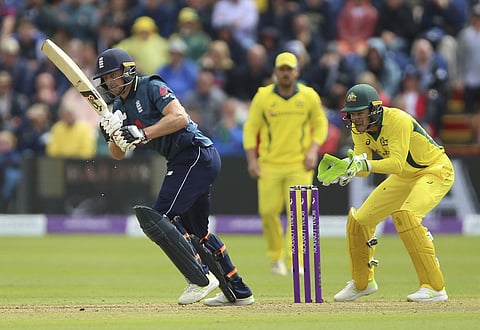 England's Jos Buttler, left, and Australia's Tim Paine (File photo | AP)