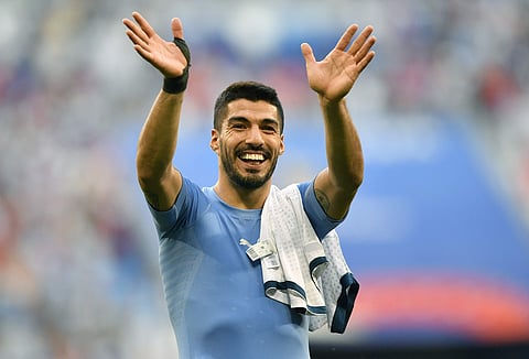 Uruguay's Luis Suarez celebrates following his team's 3-0 win over Russia in their group A match at the 2018 soccer World Cup at the Samara Arena in Samara. | AP