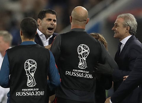 Spain head coach Fernando Hierro, left, breaks up an argument between players on the Spanish and Moroccan benches after the group B match between Spain and Morocco at the 2018 soccer World Cup at the Kaliningrad Stadium in Kaliningrad. | AP