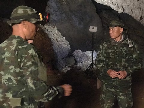 (Rescuers at the Tham Luang Cave in Thailand | AP)